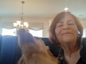 woman with dog on couch