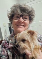woman with a dog in her lap